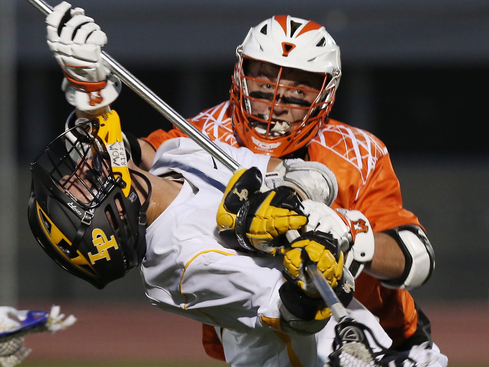 Lakeland/Panas' Joseph Cortese (1) takes a big hit from Mamaroneck's Matt Brodie (10) during the Section 1 championship game at White Plains High School May 25, 2016.
