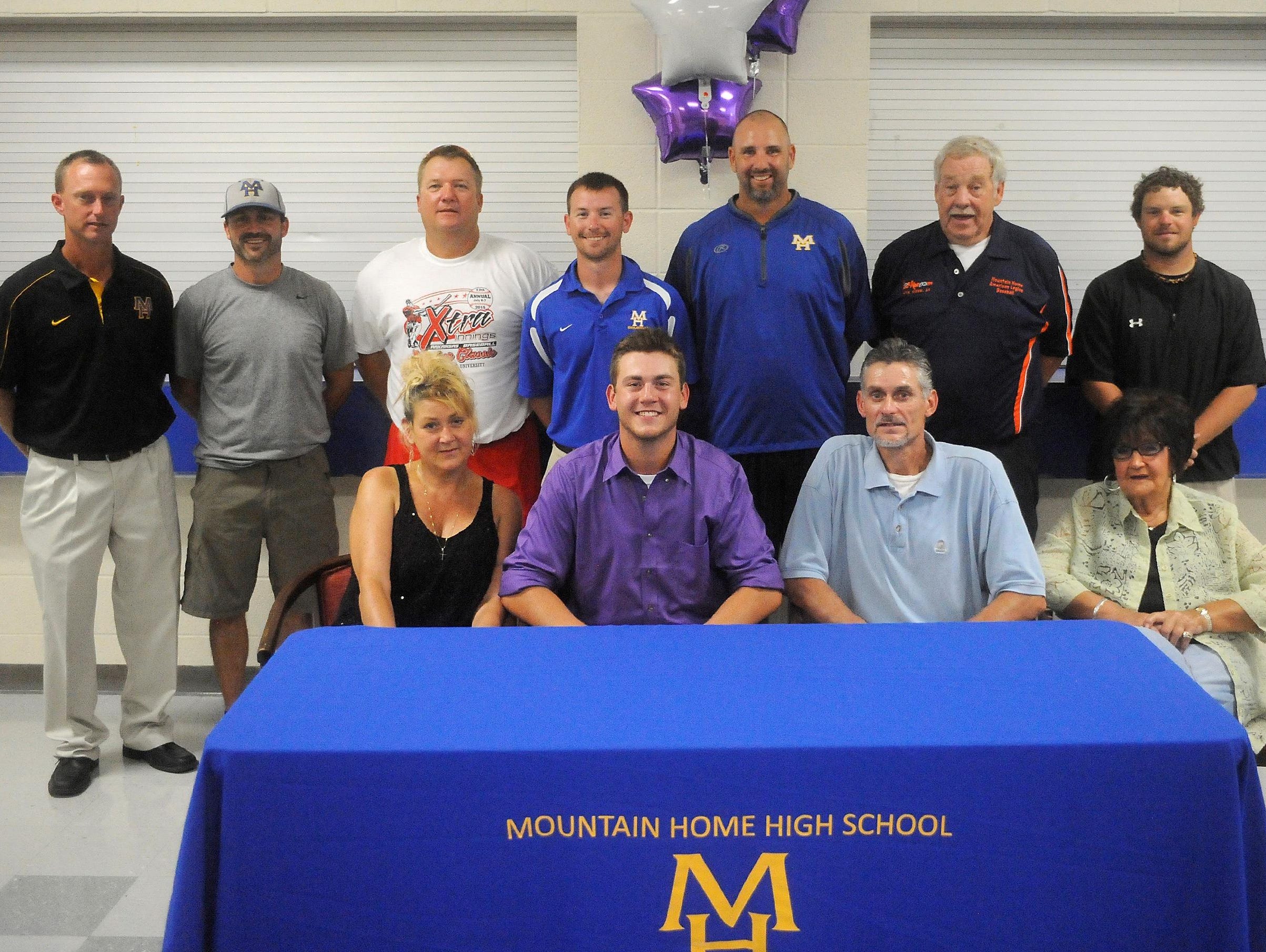 Mountain Home’s Sky-Lar Culver has signed a Division I National Letter of Intent to play baseball at the University of Central Arkansas in Conway. Shown at the signing ceremony on Wednesday are: first row, from left, mother, Kim Culver; Culver; father, Ron Culver; grandmother, Frieda Casteel; back row, Mountain Home athletic director Mitch Huskey; youth baseball coach Jason Hannaford; Lockeroom assistant coach Marty Ninemire; Mountain Home assistant coach Blake Hendricks; Mountain Home head coach Jim Tejcek; Lockeroom head coach Lester White; and Lockeroom assistant coach Clayton Gardner.