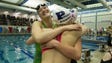New state record holder Linsday Stone left, hugs her