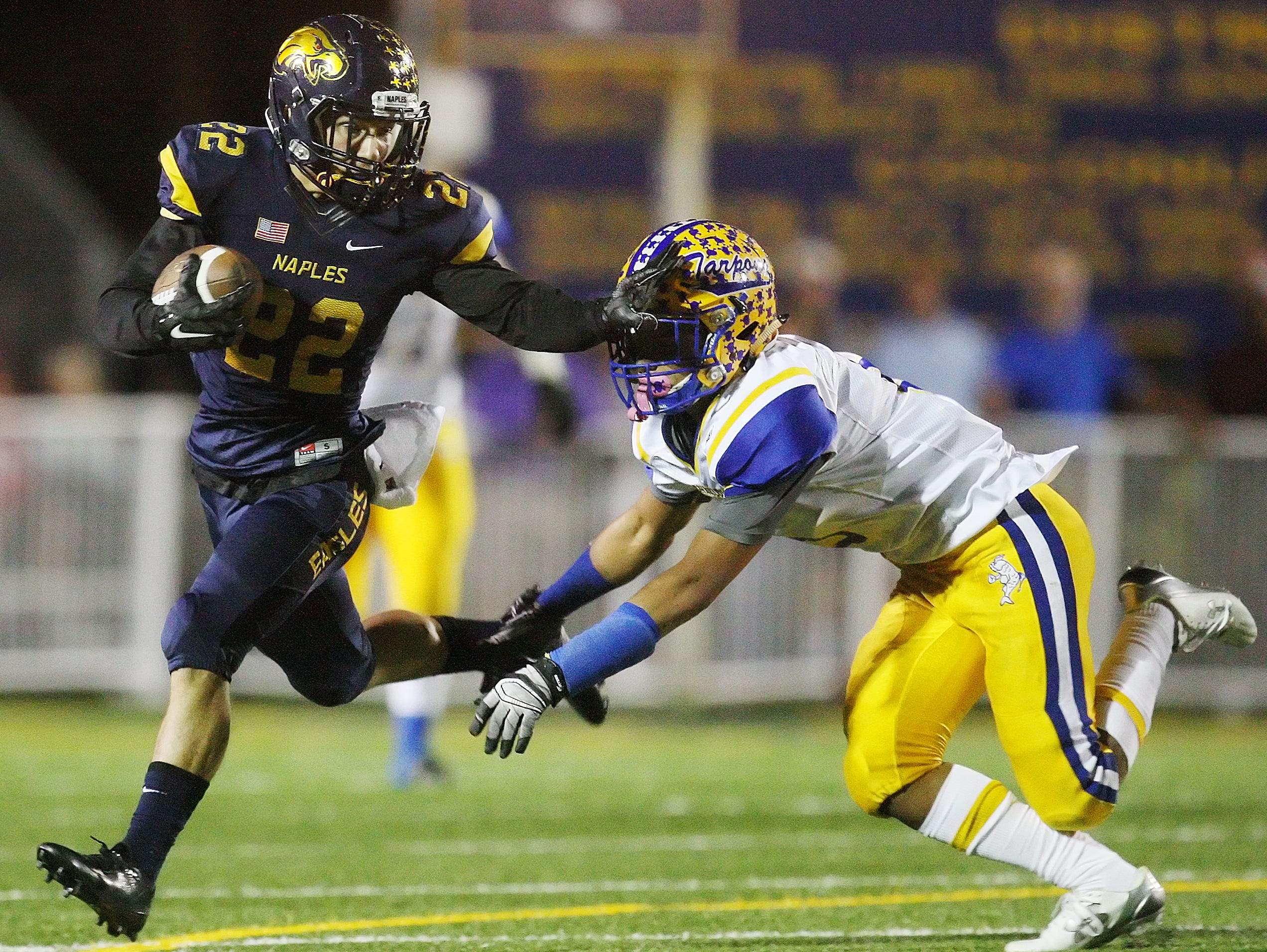 Naples High School's Antonio Carbonaro breaks free from Charlotte's Jacob White during the Class 6A Region 3 final Friday at Naples High School.