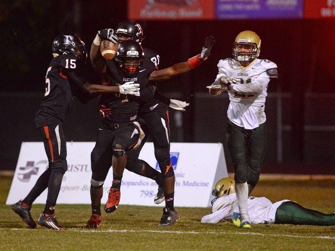 Mississippi State signee C.J. Morgan celebrates a touchdown pass in the end zone as the final seconds tick off the clock to end the first half of the Panther's Class 5A second-round playoff game against Acadiana.