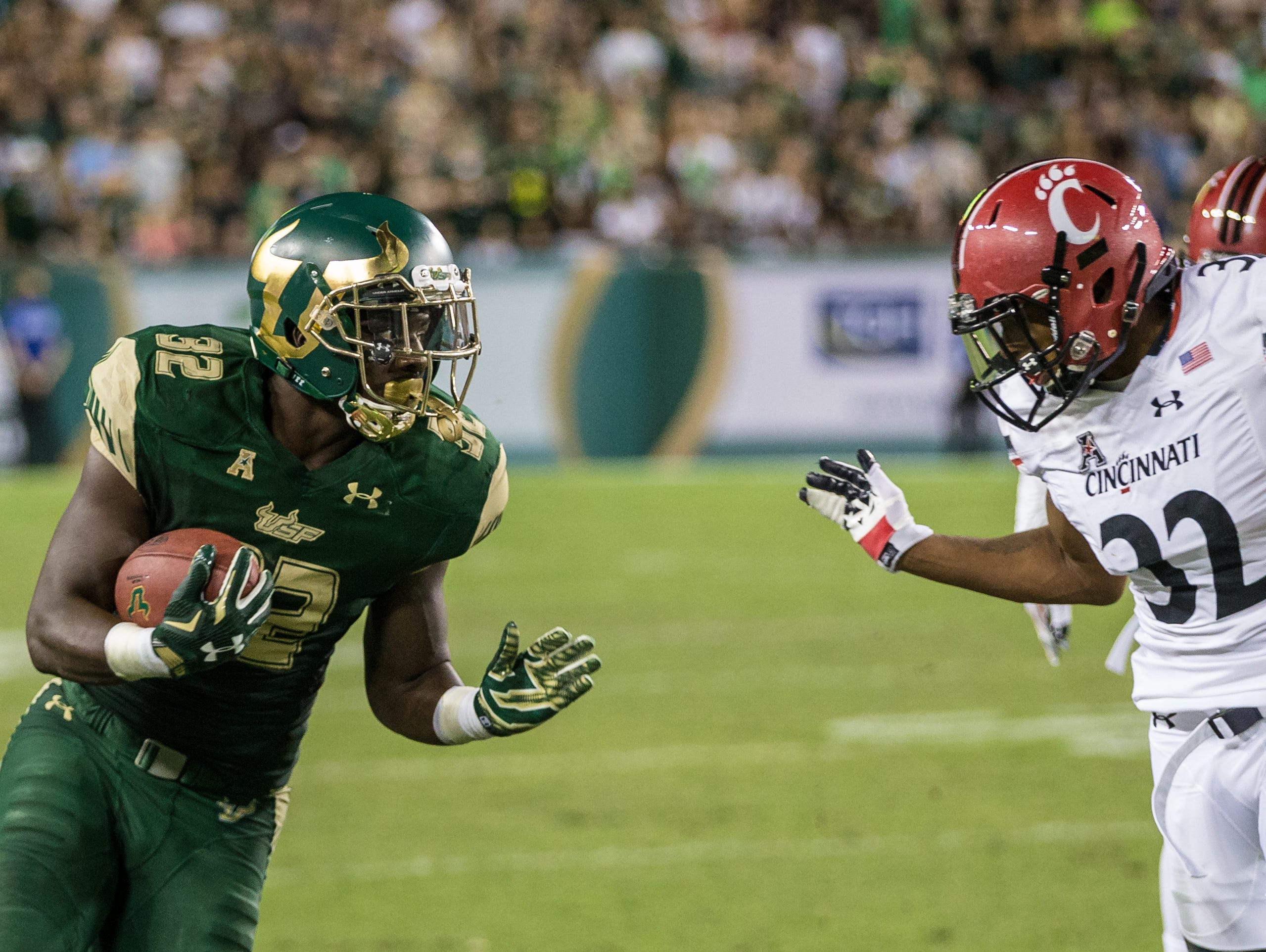 South Florida Bulls running back D'Ernest Johnson carries the ball for a gain during a NCAA football game between the Cincinnati Bearcats and South Florida Bulls at Raymond James Stadium on Friday, November. 20, 2015 in Tampa.