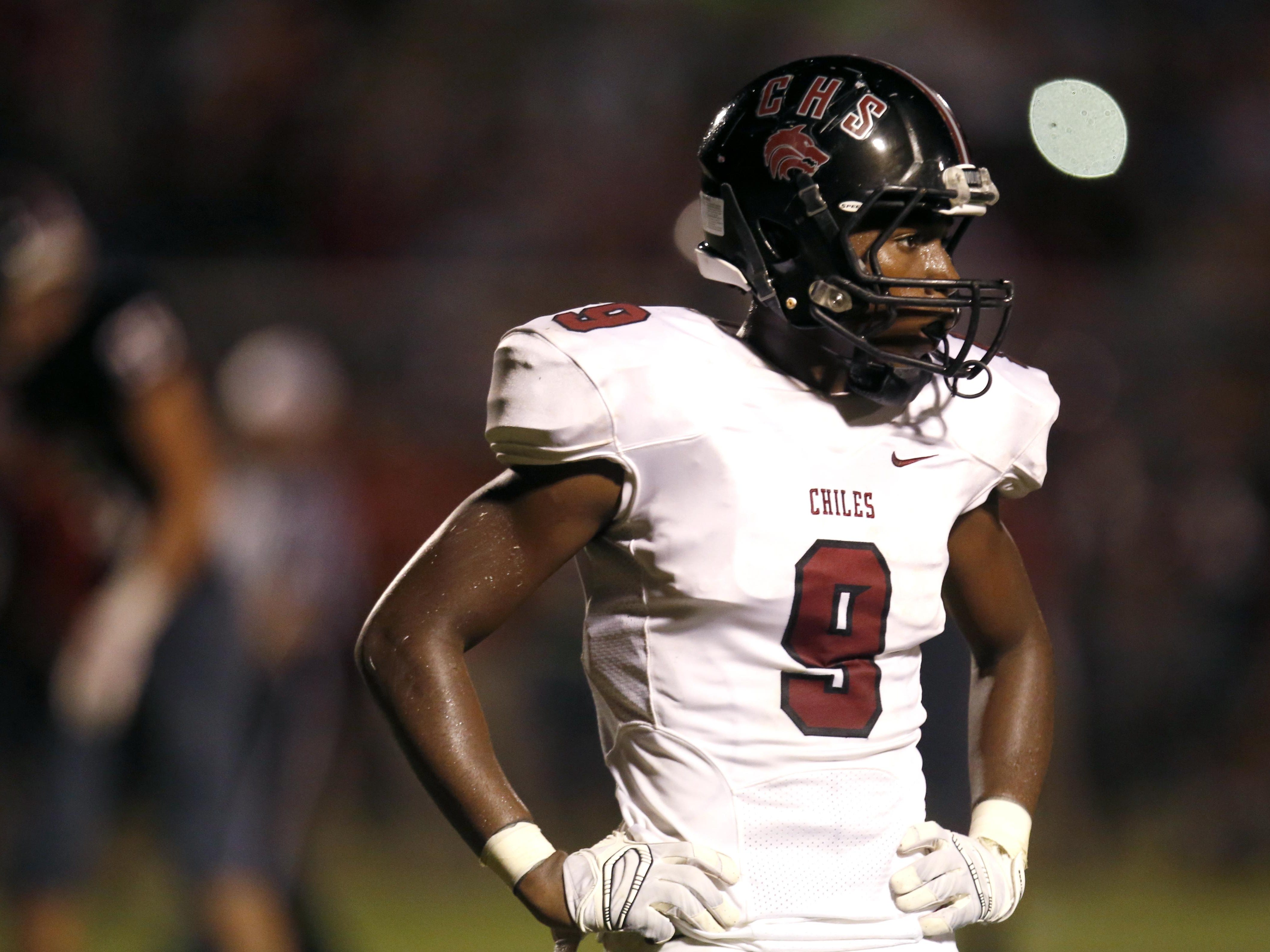Chiles' Shane Sanders looks to the sidelines for a play call against NFC during their game at NFC High School on Friday.