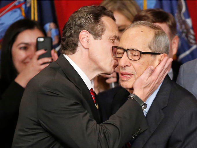 Democratic New York Gov. Andrew Cuomo kisses his father,