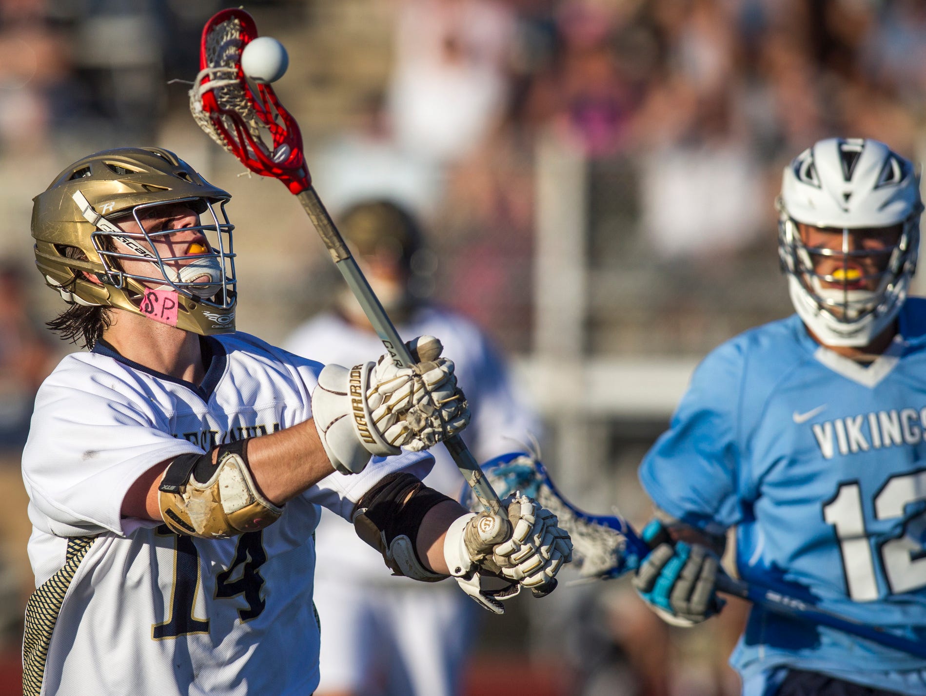 Salesianum’s Terrence Logue sends a pass downfield in the first half of the DIAA Boys Lacrosse Tournament championship game at Caravel Academy on Saturday night. Salesianum defeated Cape Henlopen 16-5.