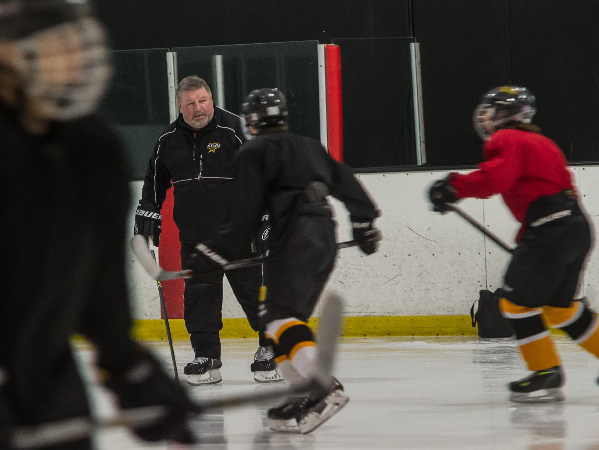 South Brunswick High School ice hockey coach Sergei Starikov conducts practice on Friday, Nov. 20.