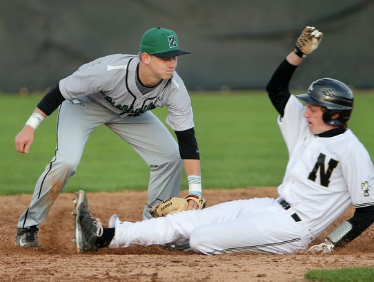 Zionsville's Riley Bertram tags out Noblesville's Jackson