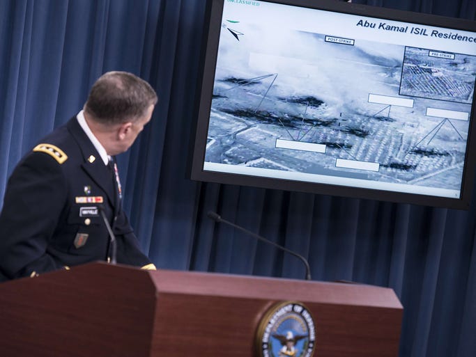 Lt. Gen. William C. Mayville Jr., Joint Staff Director of Operations Director of Operations, shows before and after images of airstrikes in Syria during a briefing at the Pentagon September 23, 2014 in Washington, DC. Mayville briefed the press about US and Arab nation joint airstrikes against Islamic State group targets in Syria and unilateral airstrikes against an al-Qaeda group in Syria. AFP PHOTO/Brendan SMIALOWSKIBRENDAN SMIALOWSKI/AFP/Getty Images ORIG FILE ID: 533706179