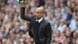 Manchester City manager Pep Guardiola throws the ball
