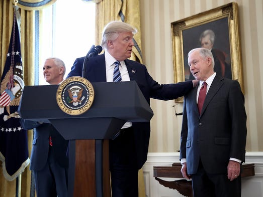 President Trump puts his hand Sessions