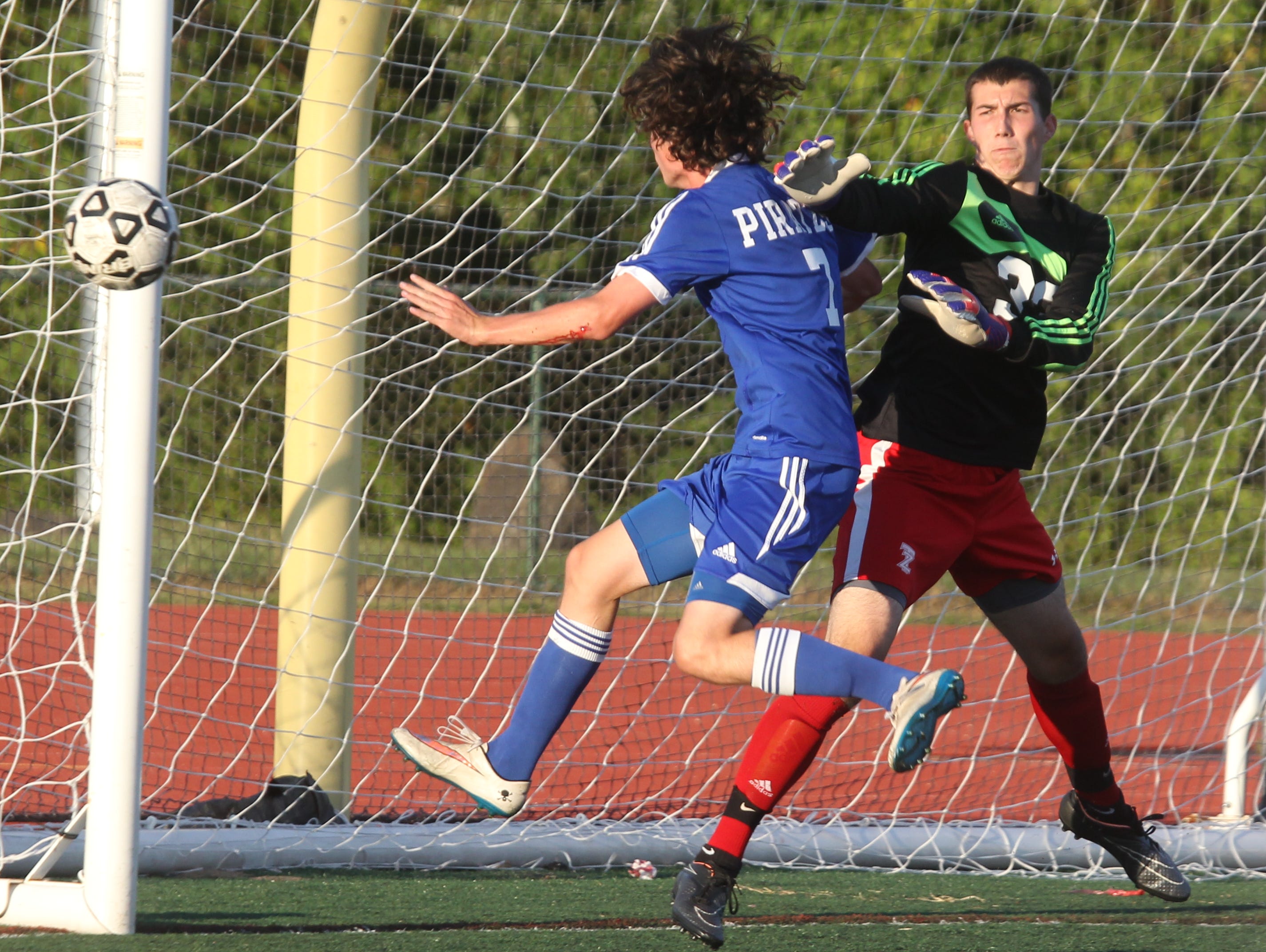 Pearl River's Brian Flaherty heads the ball wide of the net and Tappan Zee goalie John Connor during a game at Tappan Zee Sept. 24, 2015. Pearl River won1-0.