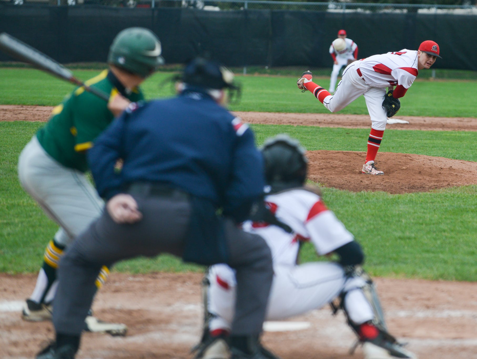 Marshall's Drew Devine pitches against Pennfield earlier this season.