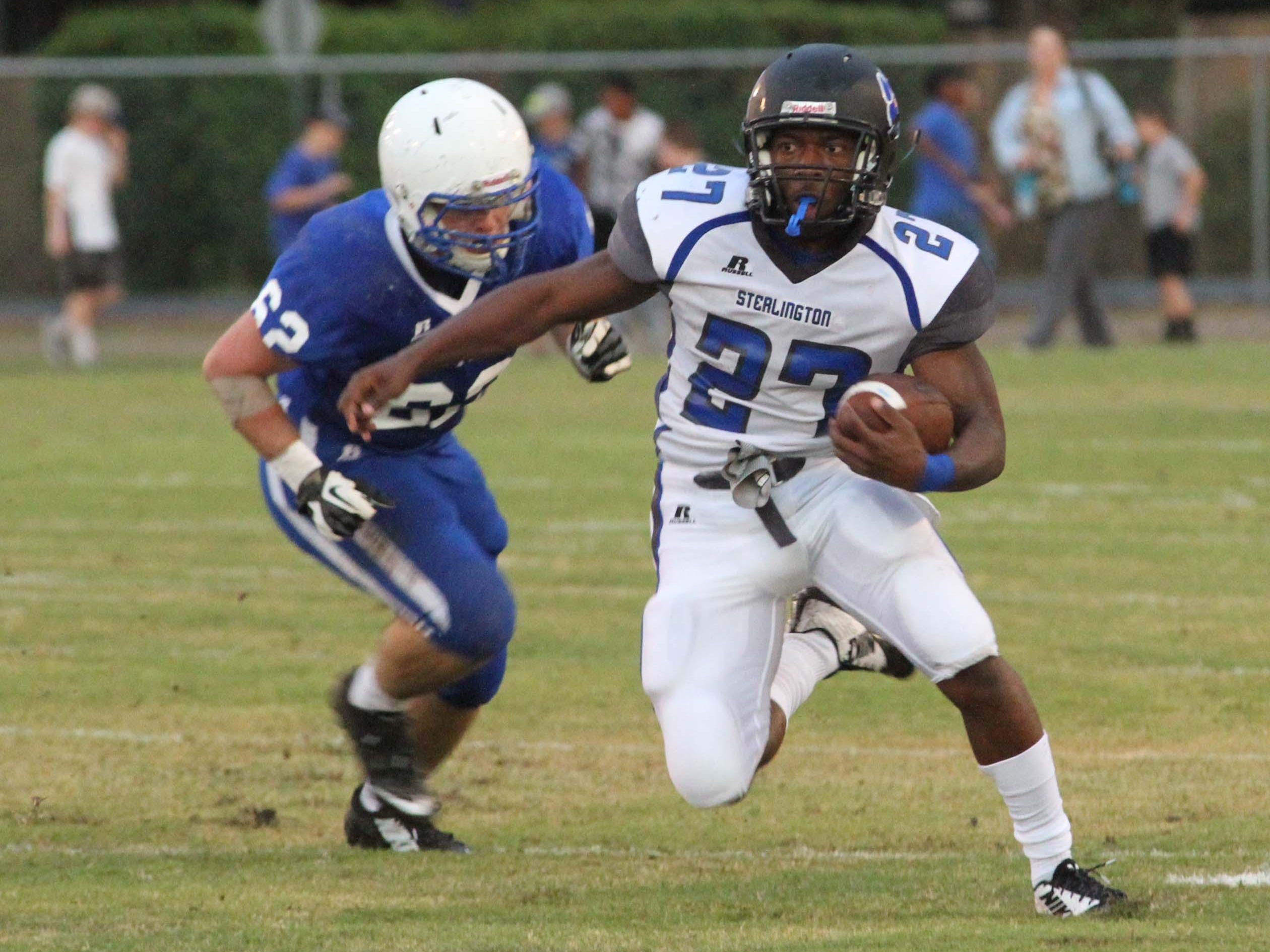 Sterlington's DeVante Douglas (27) carries the ball for the Panthers in first half action against the St. Frederick Warriors Friday night in Monroe.
