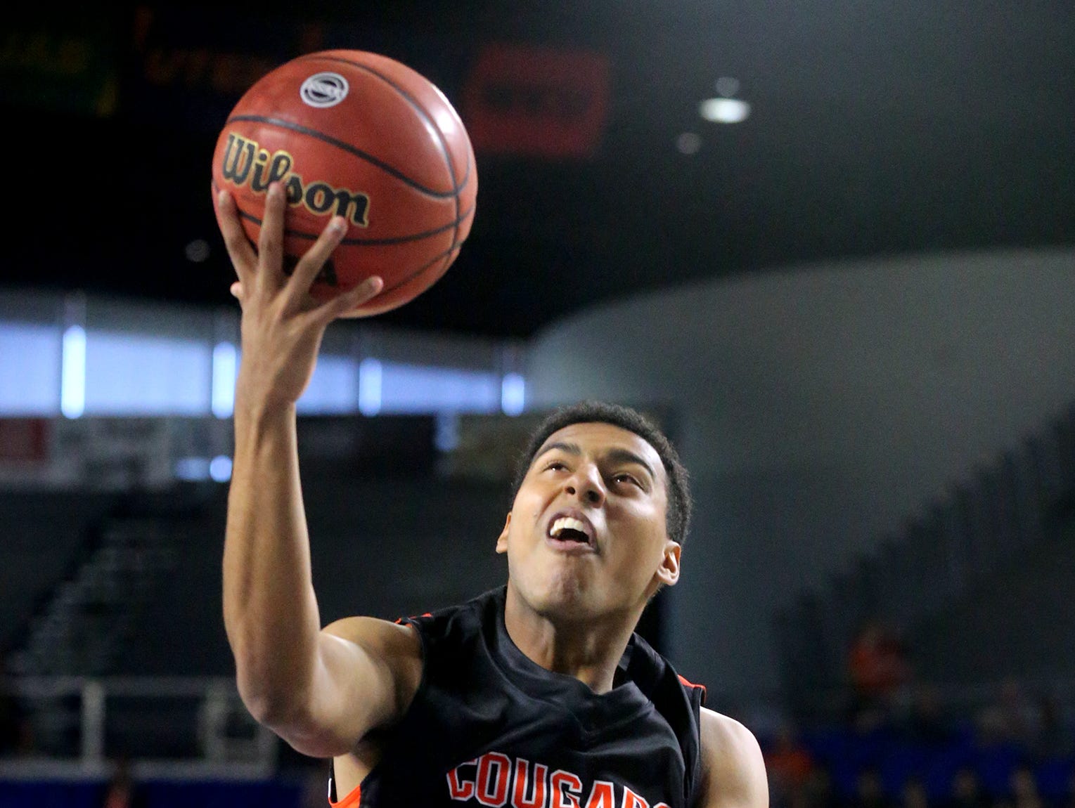 MTCS's Joseph Peck (14) goes up for a shot against Mitchell during the state tournament quarterfinal game on Thursday March 17, 2016, at MTSU.