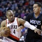 Portland Trail Blazers guard Arron Afflalo, left, drives to the basket against Minnesota Timberwolves guard Kevin Martin during the first half of an NBA basketball game in Portland, Ore., Wednesday, April 8, 2015.