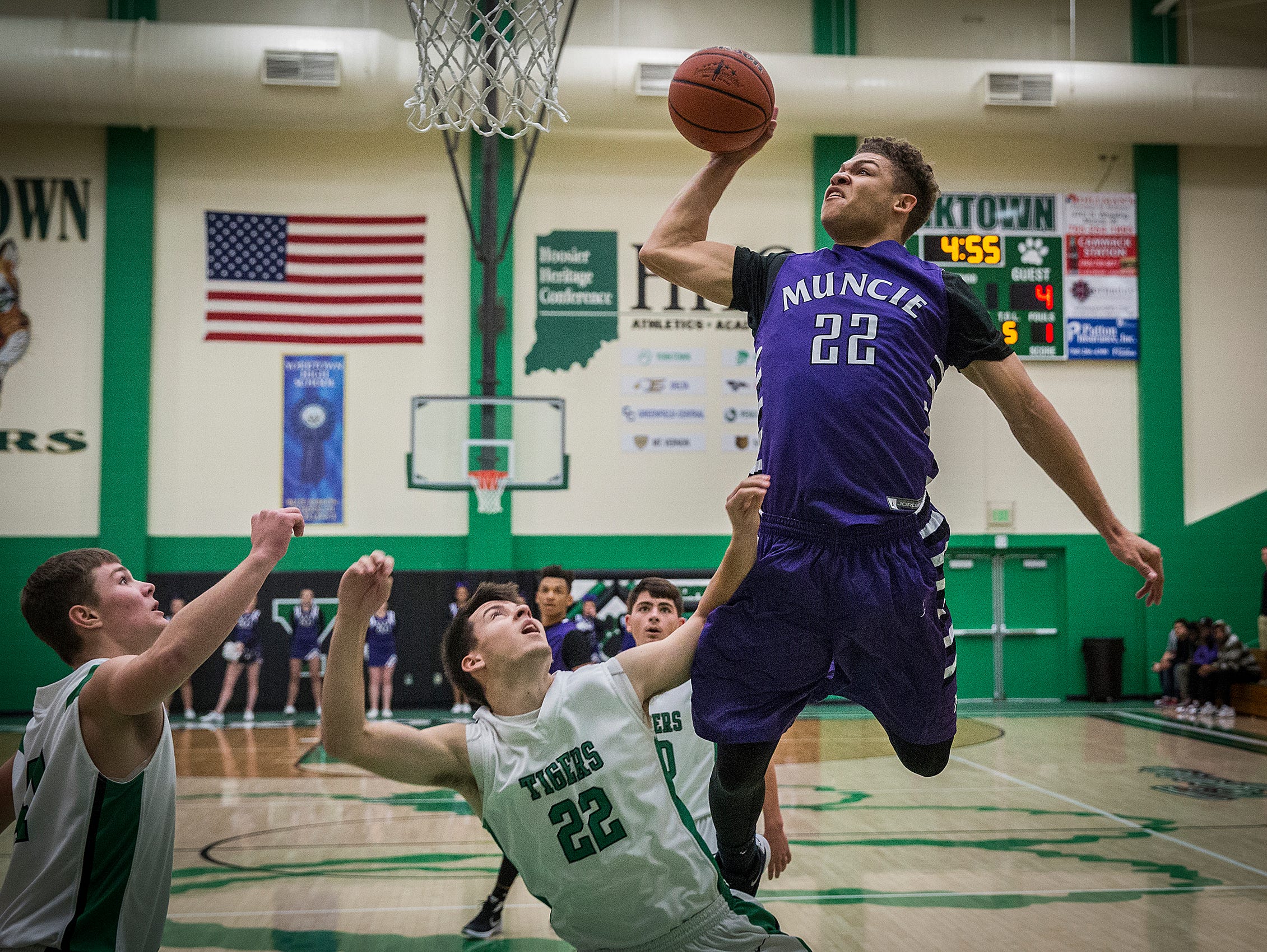 Central's Andre Jones goes up for a shot against Yorktown during their game at Yorktown High School Saturday, Nov. 28, 2015.