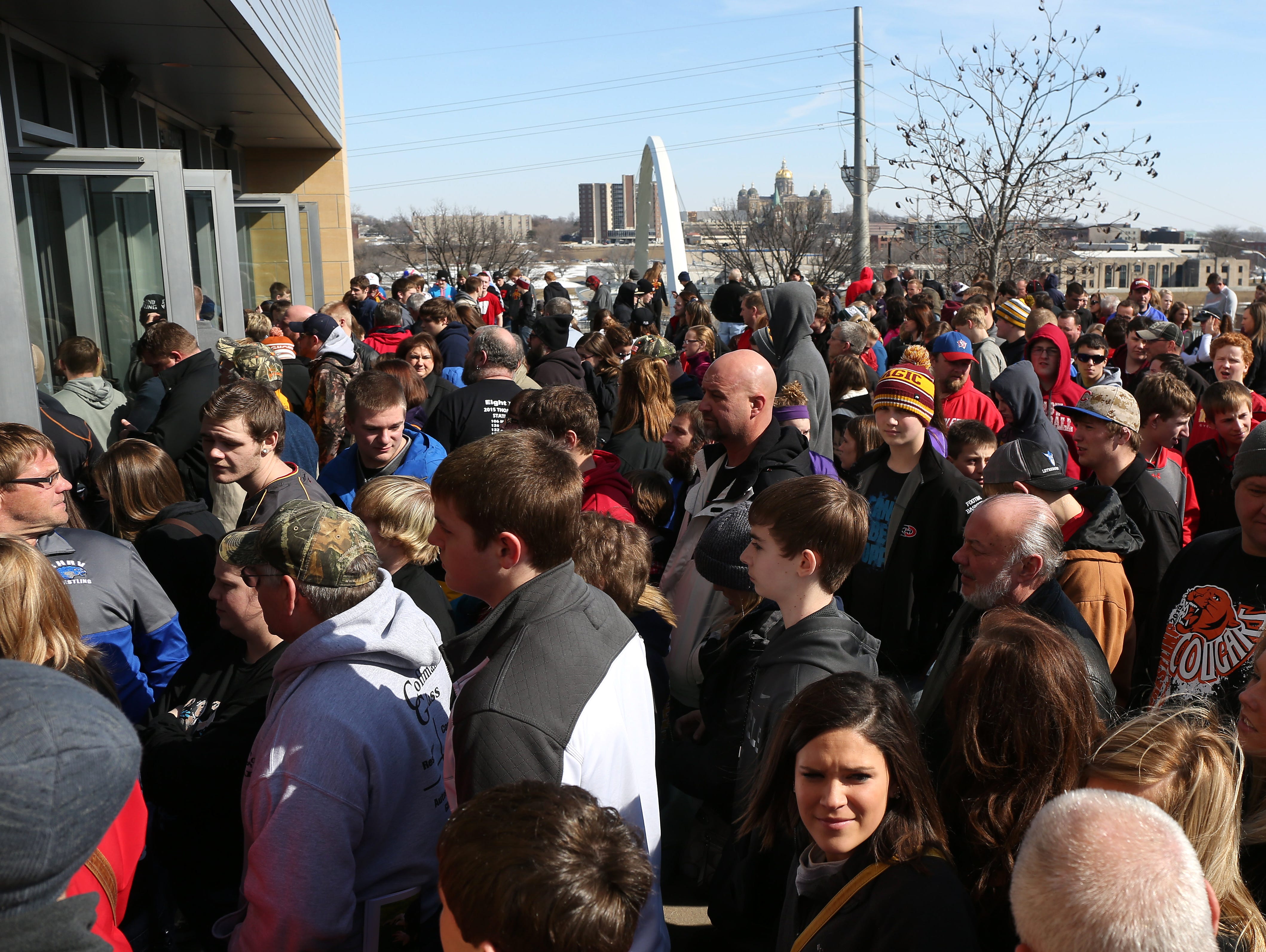 Fans begin to file into Wells Fargo Arena for the afternoon session on Friday, Feb. 20, 2015, during the 2015 Iowa state wrestling meet in Des Moines, Iowa.