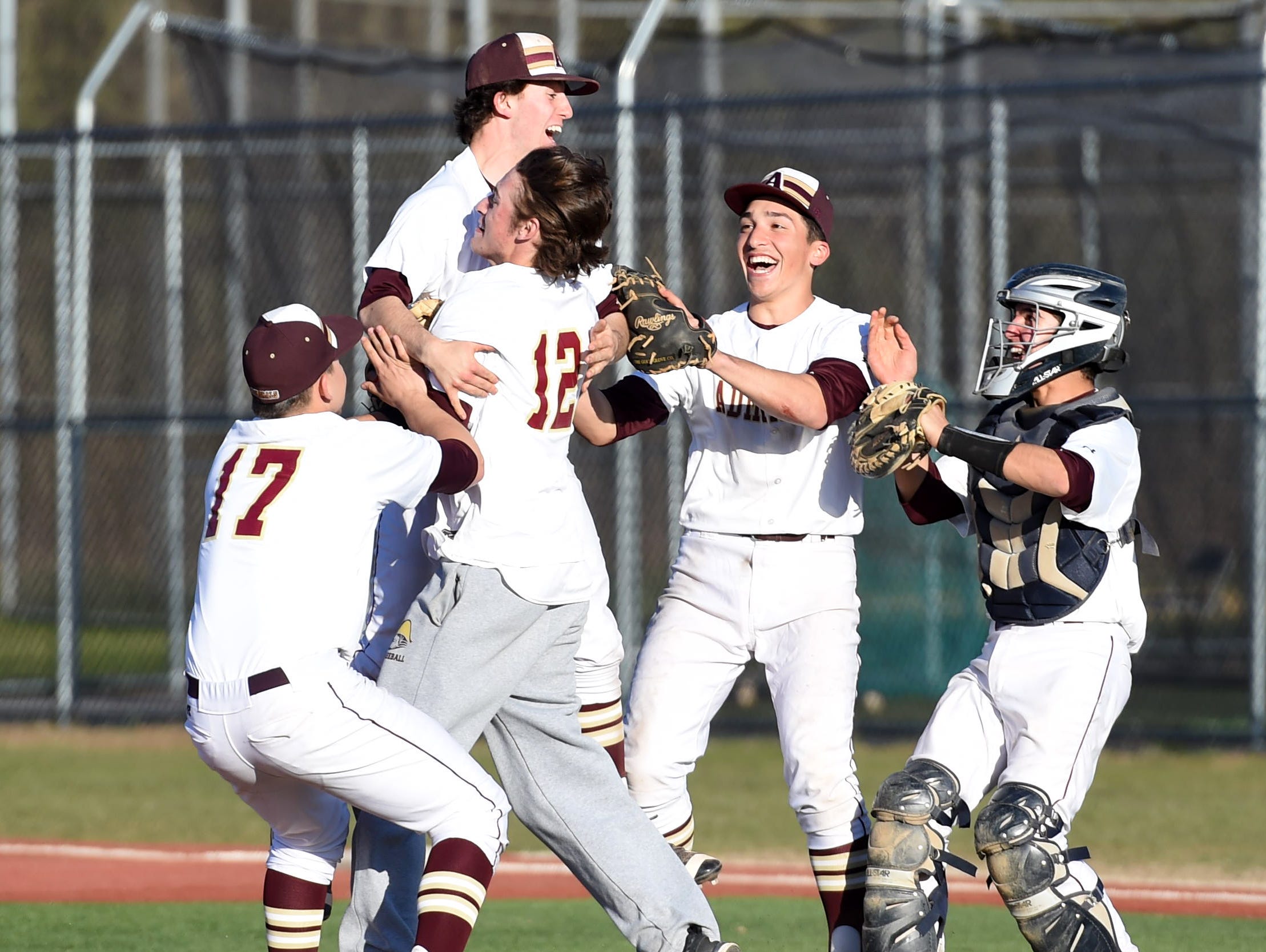 Arlington's pitcher, Mike Pascoe is hoisted up by teammate Connor Chiulli after pitching a no-hitter versus Mahopac on Friday at Arlington High School.