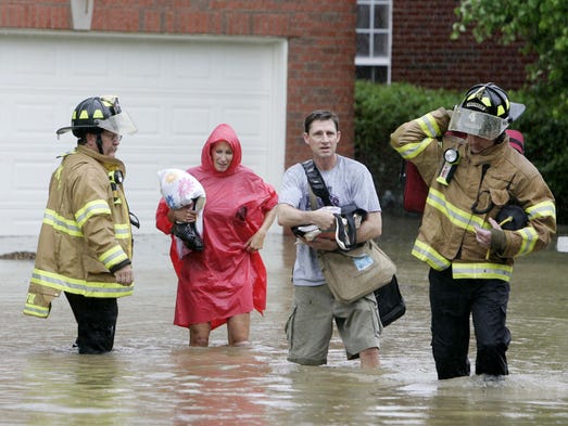 Mary and Robert Benson, center, are assisted by Franklin