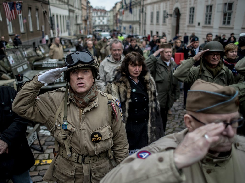 History enthusiasts dressed in WWII U.S. Army uniforms salute as the national anthem is played during the 'Convoy of Liberty' commemoration event in Prague, Czech Republic. The 'Convoy of Liberty' commemorates the moments in 1945 when the western par