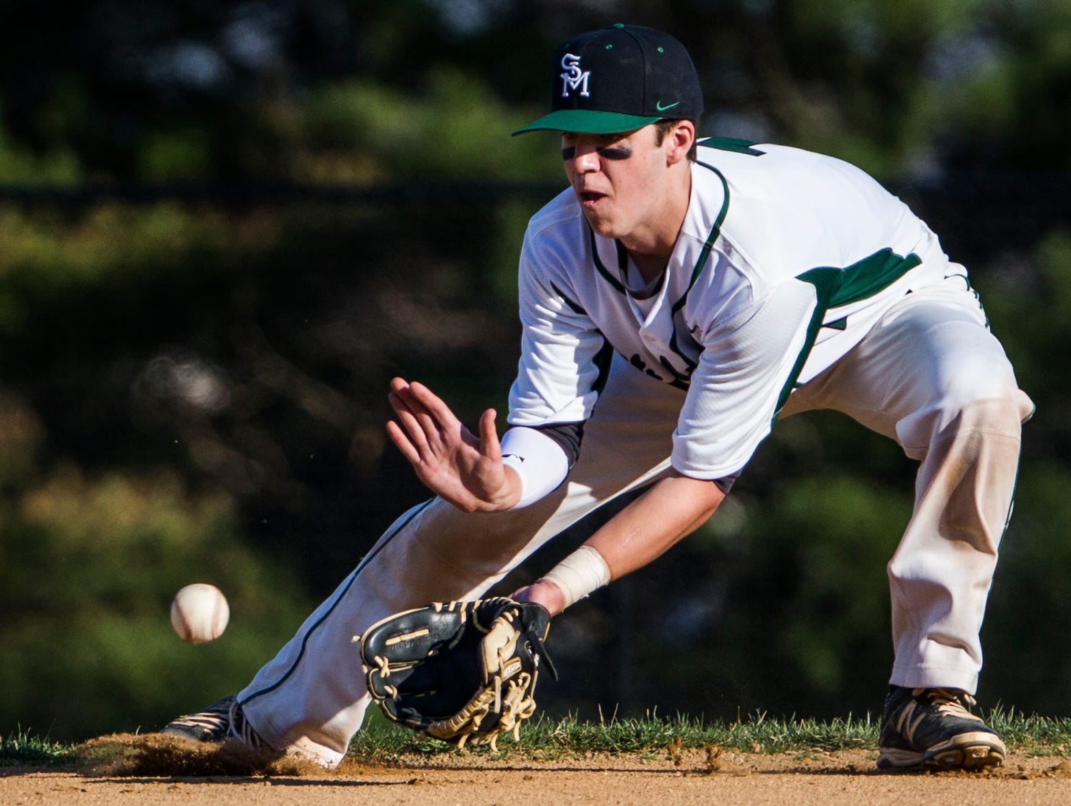 St. Mark's Brian Gilardi fields a ground ball during the Spartans' March 23 win over Hodgson. No. 3-ranked St. Mark's has three games scheduled during the school's spring break this week.