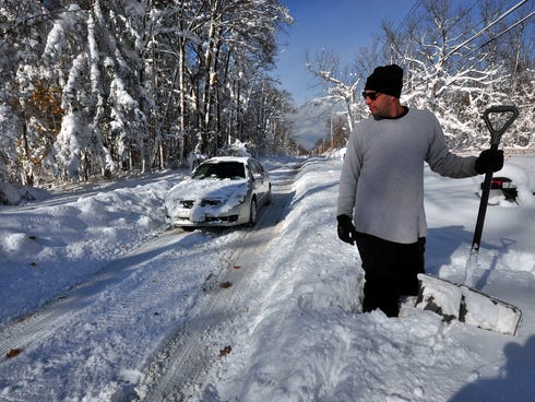 Greg Mitri shovels his way through nearly five feet of snow on Nov. 19 in the Lakeview neighborhood of Buffalo.