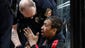 A Baltimore Police officer checks on a man who was