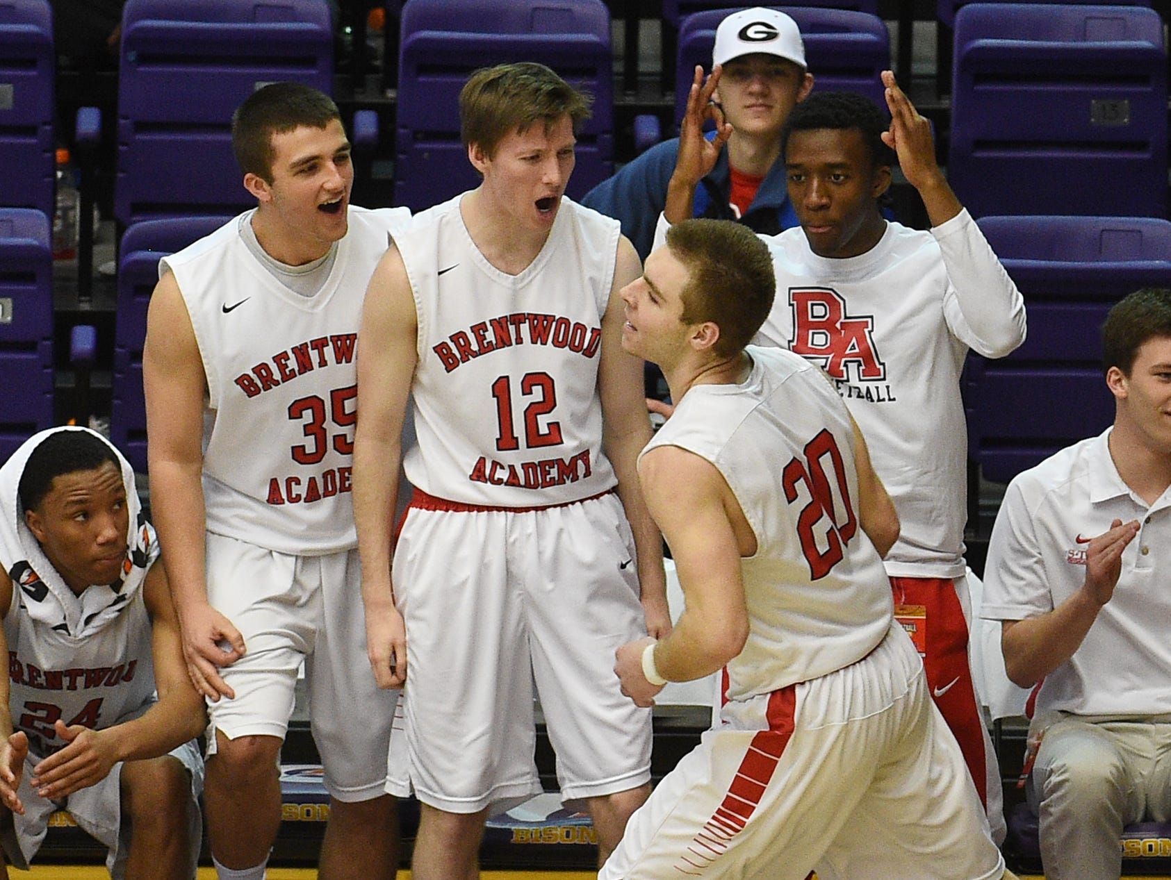 Brentwood Academy celebrates after Jeremiah Oatawall (20) scores during the TSSAA DII-AA semifinals at Lipscomb University on March 4, 2016.