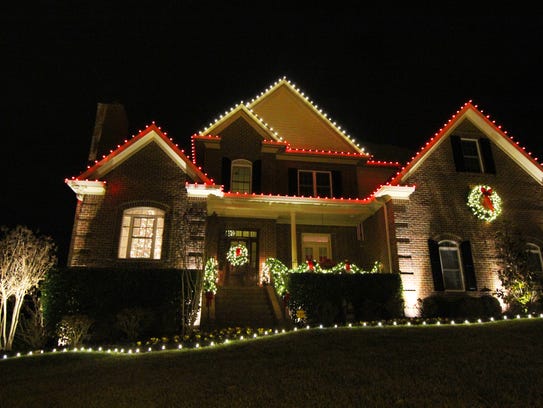 Ken Walter’s home in Franklin is festive with its red