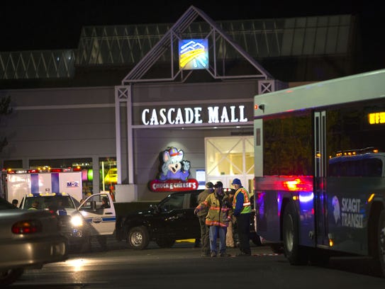 Police attend the Cascade Mall after four women died