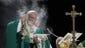 Pope Francis blesses the Eucharist with incense while
