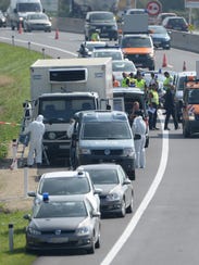 Forensic experts investigate a truck in Parndorf, Austria,