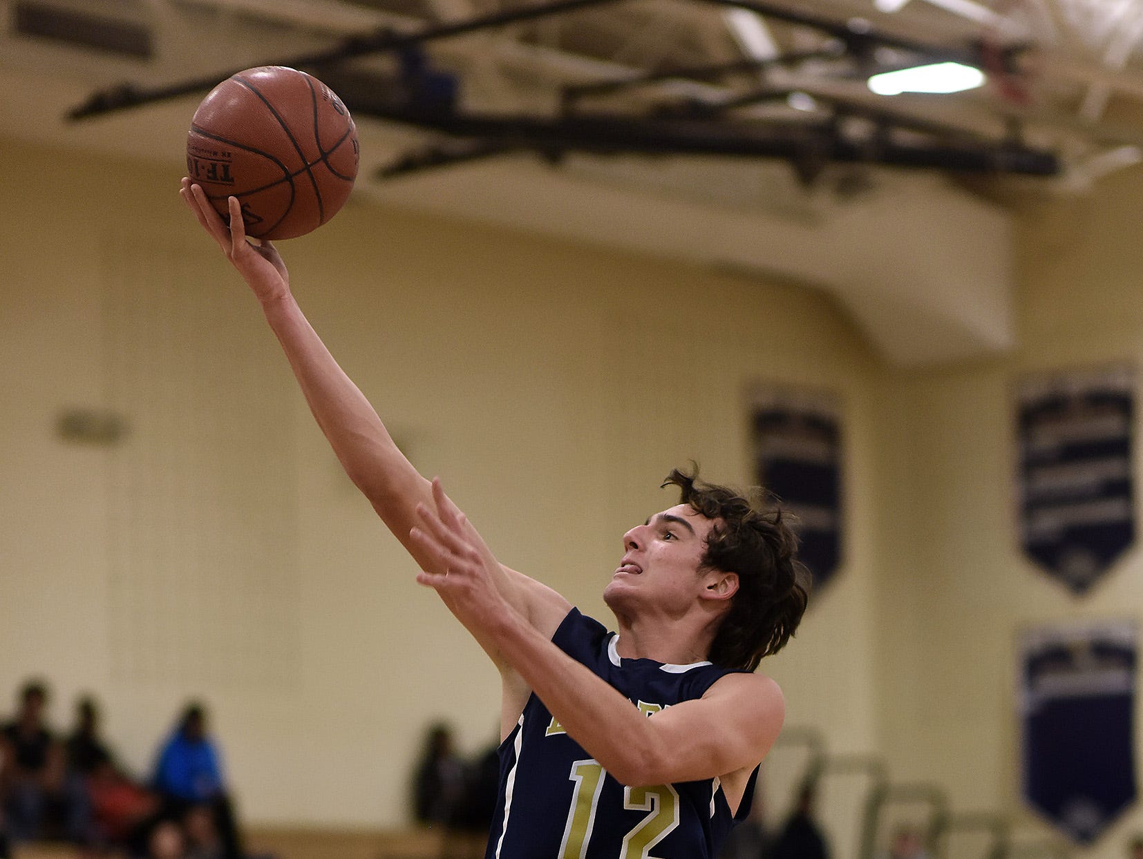 Our Lady of Lourdes High School's Luke Timm flies to the hoop against Beacon on Dec. 11 in Beacon.