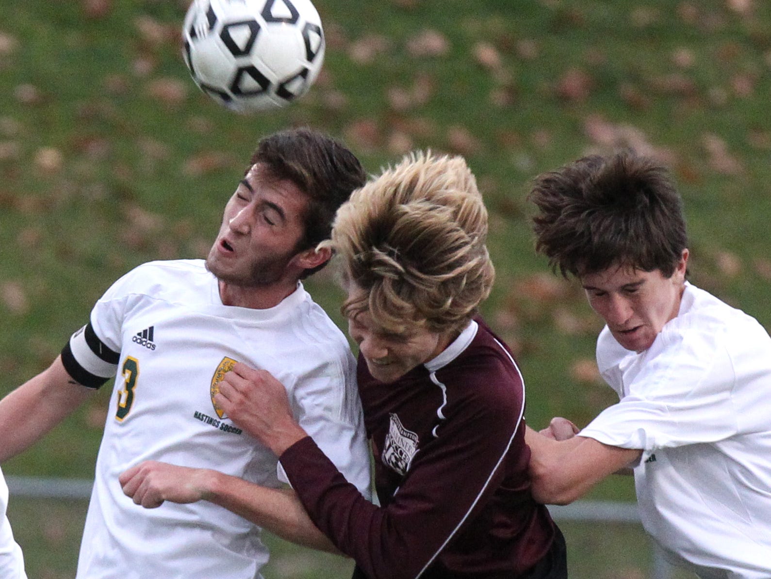 Hastings' Will Berritt, left, goes up for a header with Southampton's Sebastian Pereira during their Class B boys soccer regional final Nov. 7, 2015. Hastings won 1-0.