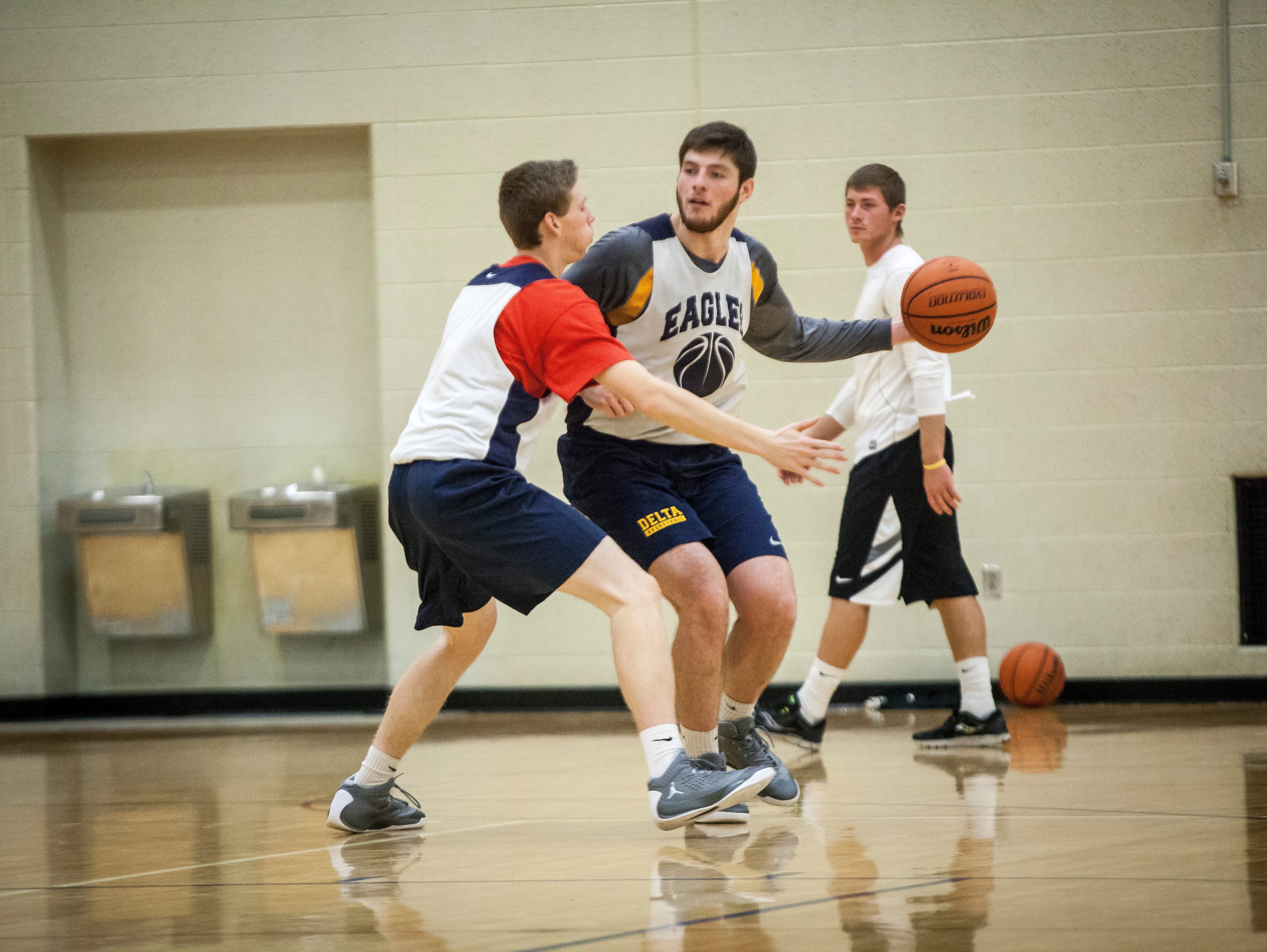 Delta's Boys Basketball Team practices in the side gym of Delta High School Monday afternoon.