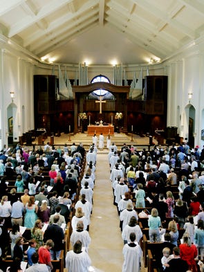 Church members attend services at St. George's Episcopal