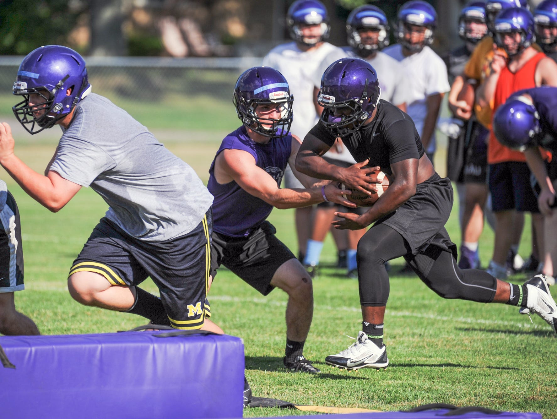 The Lakeview Spartans run through summer drills Tuesday night at Lakeview's practice field.