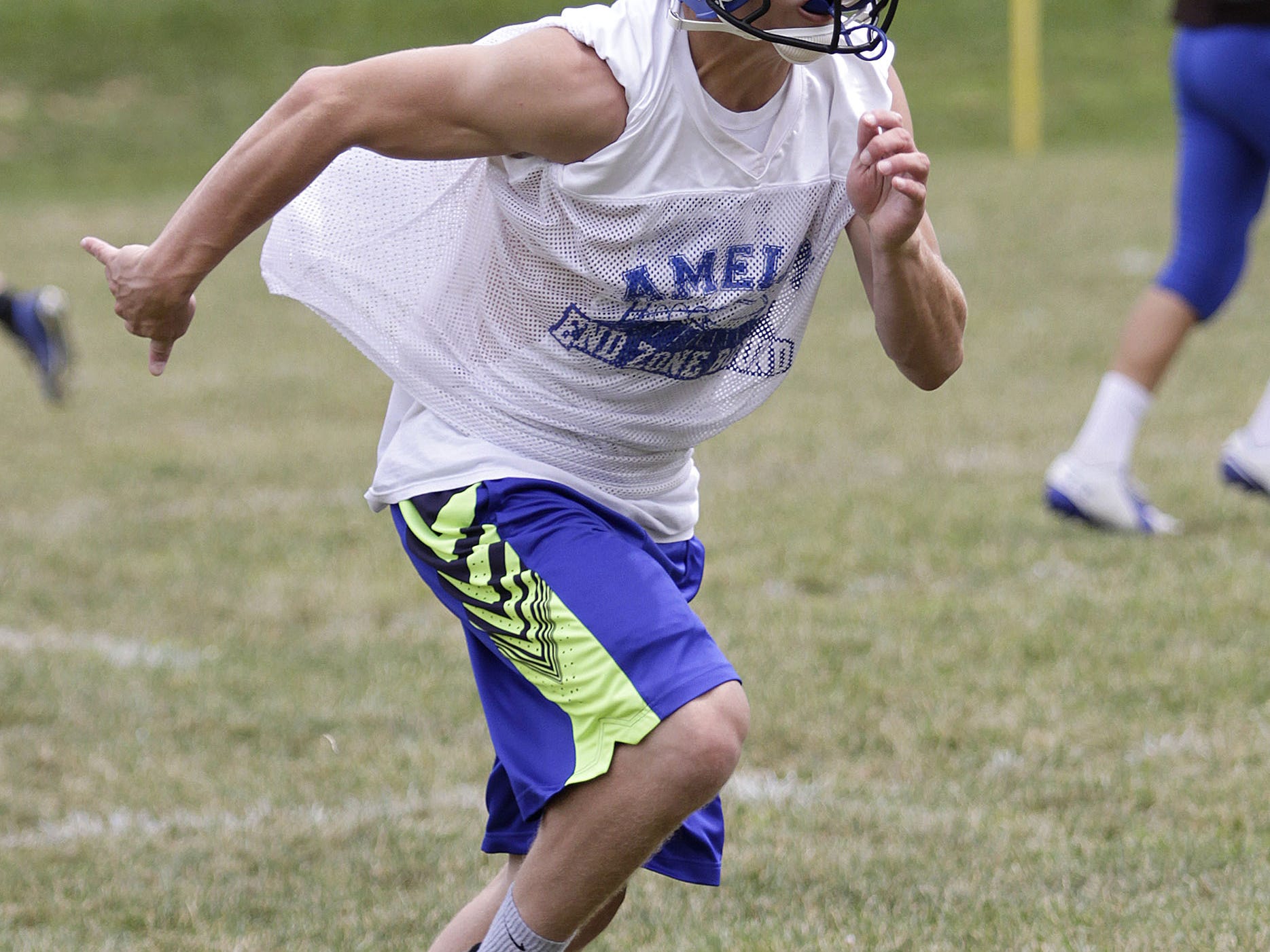  Garrett Weaver sprints down the sideline on a cover drill. Amelia gears up for their season opener at home against long time rival, Glen Este. 