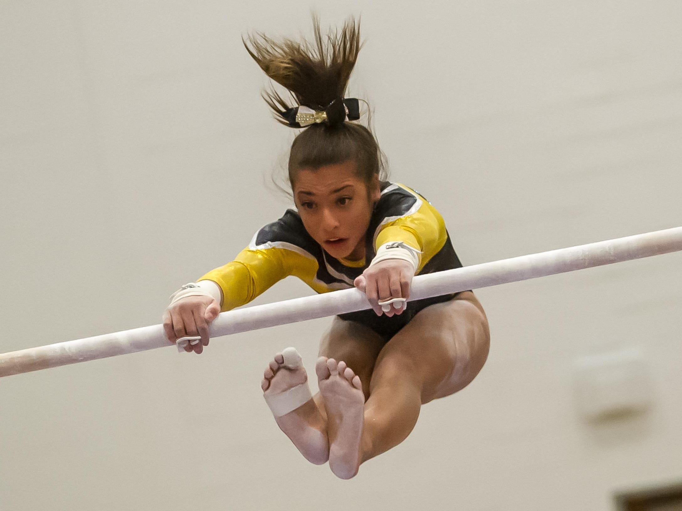 St. John Vianney's Arianna Agrapides competes on the bars in the NJSIAA Gymnastics state individual championship at Montgomery High School on Saturday Nov. 14, 2015. Photo by Jeff Granit