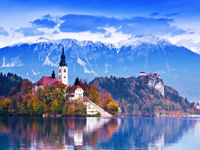 Perched on an island in the middle                                                           of Bled Lake                                                           in Slovenia,                                                           the Church of                                                           Assumption is                                                           only reachable                                                           by handmade                                                           wooden row                                                           boats.