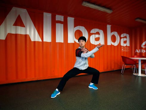 A worker performs shadow boxing during an open day at the Alibaba Group office in Hangzhou in east China's Zhejiang province on  March 26, 2013. Alibaba Group is aiming to raise $1 billion in a long-awaited IPO likely to have ripple effects across th