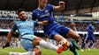 Manchester City's Sergio Aguero vies for the ball with