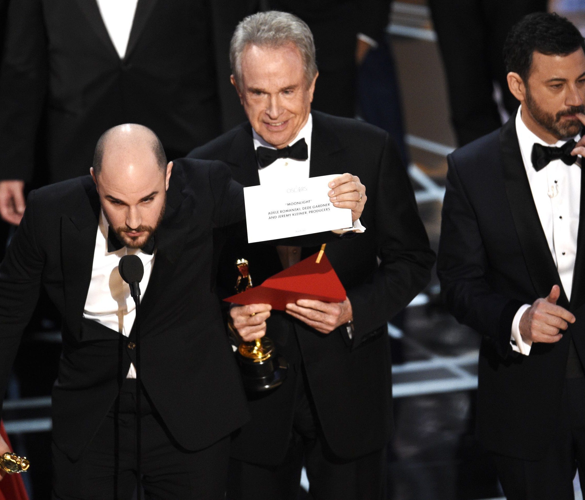 'La La Land' producer Jordan Horowitz shows the envelope revealing 