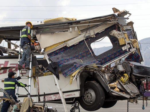 Workers remove pieces of wreckage on Interstate 10.