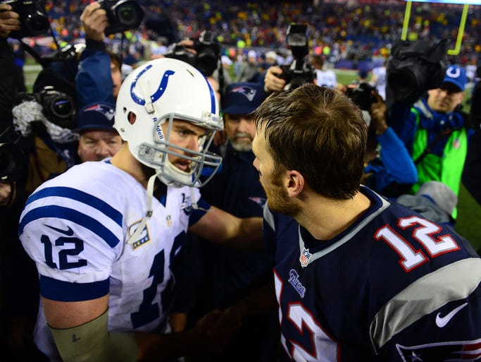 New England Patriots quarterback Tom Brady (12) shakes hands with Andrew Luck (12) after the 2013 AFC divisional playoff football game at Gillette Stadium.