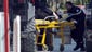A wounded person is evacuated on a stretcher from the