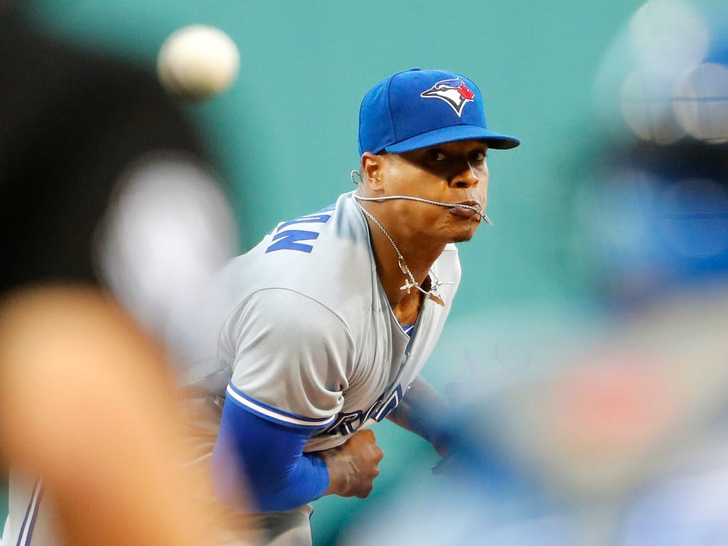 Toronto Blue Jays starting pitcher Marcus Stroman throws the ball against the Boston Red Sox during the first inning at Fenway Park in Boston.