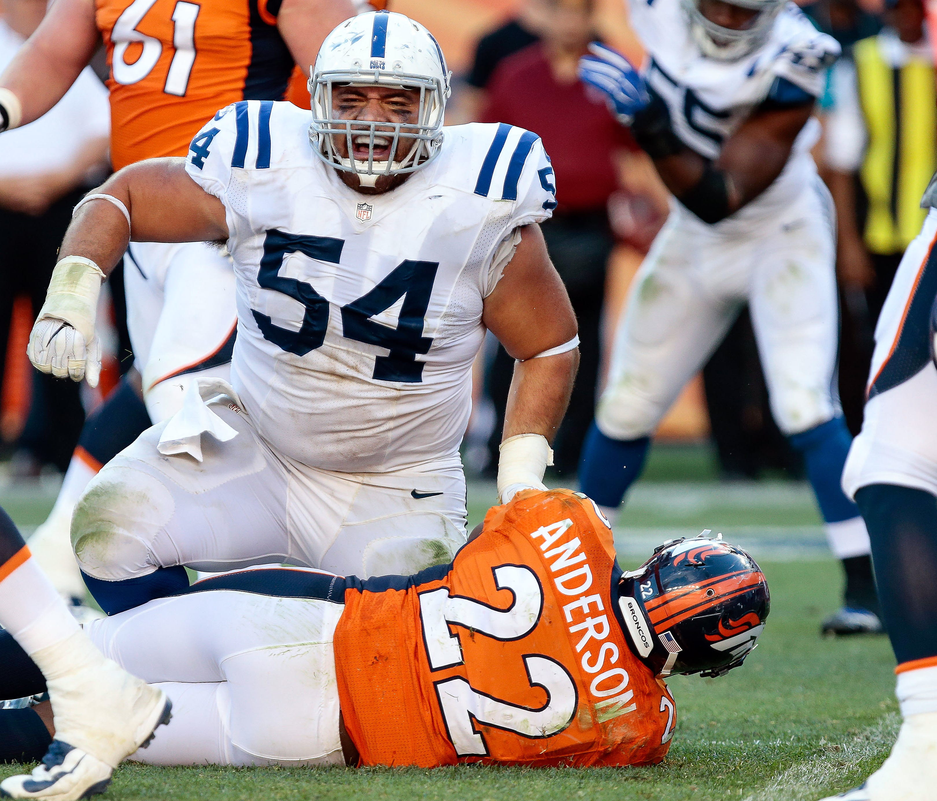 Colts nose tackle David Parry tackles Denver Broncos running back C.J. Anderson during the fourth quarter of their 2016 regular-season game at Sports Authority Field at Mile High in Denver.