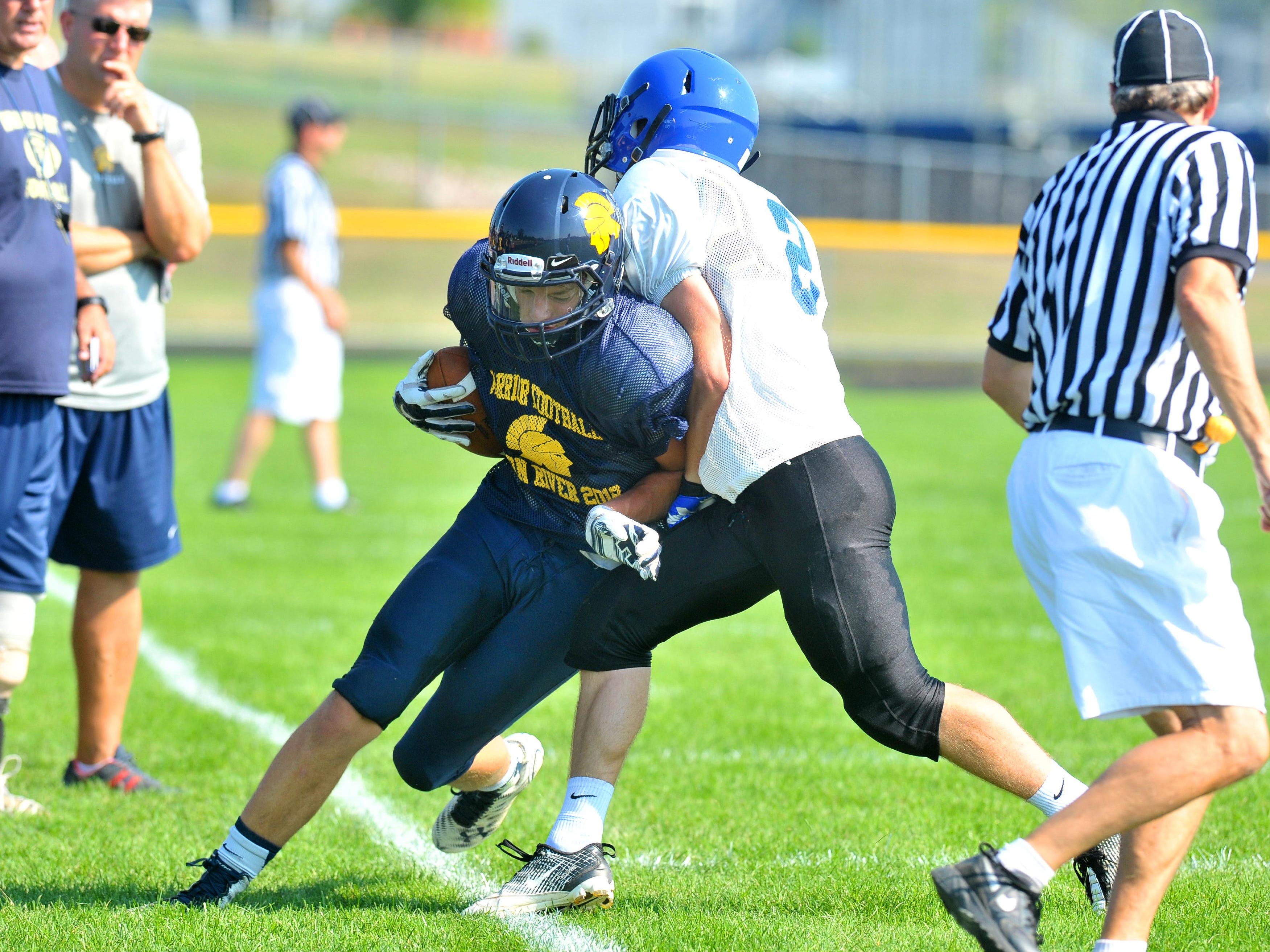 West vs. Merrill on scrimmage Friday afternoon at Wausau West High School football field.