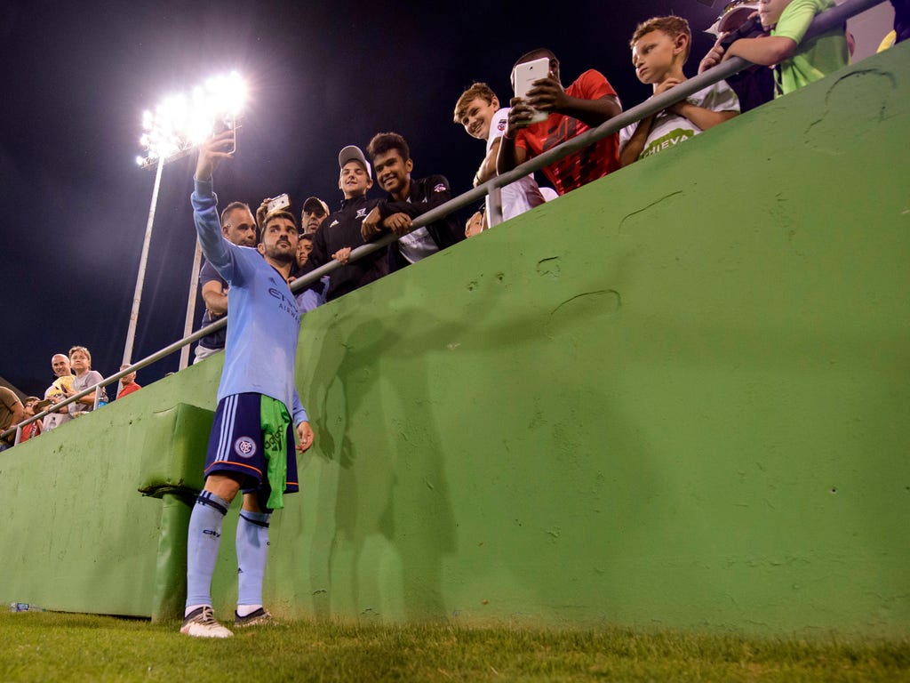 New York City FC's David Villa takes selfies with the fans after the preseason matchup against the Montreal Impact at Al Lang Stadium. NYCFC opens it 2018 season against Sporting KC on March 4.